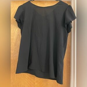 Adorable black top with ruffle sleeves.